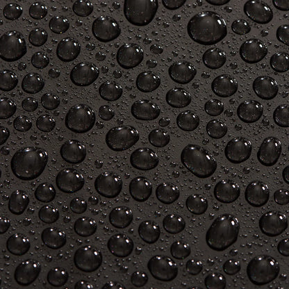 Close-up of water droplets on a black surface