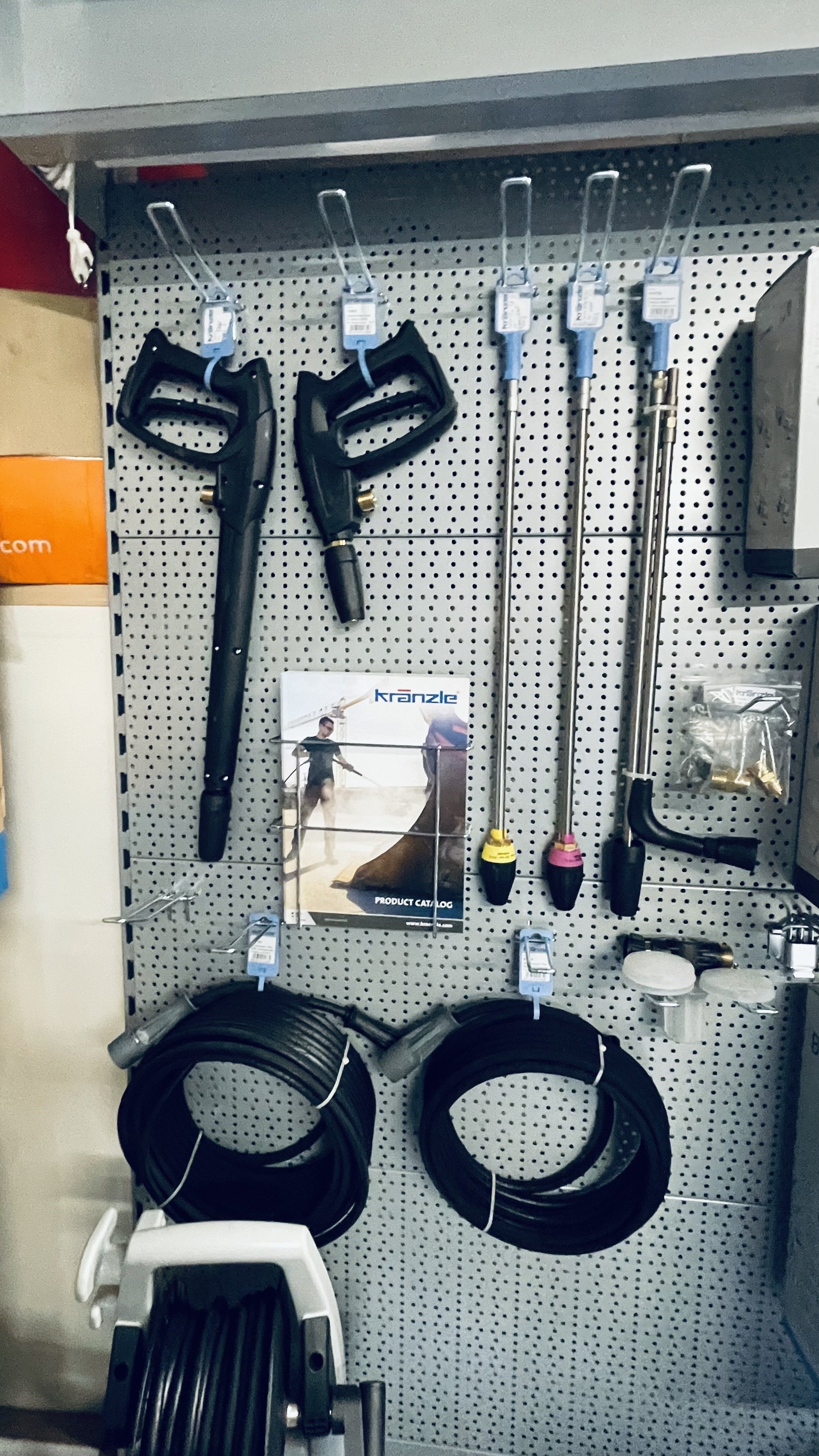 Pegboard with various tools and equipment on a shelf