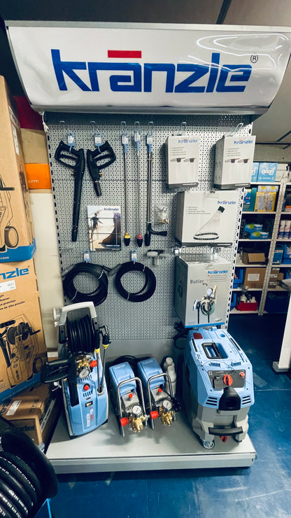 Kranzle product display with various tools and equipment on a wall-mounted board.