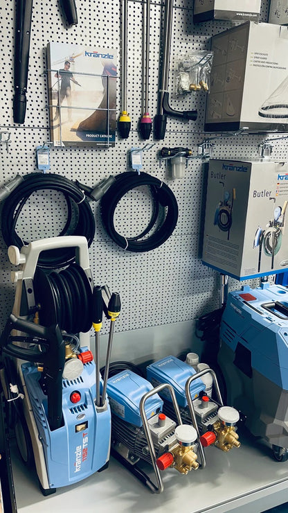 Display of pressure washers and related equipment in a store setting.