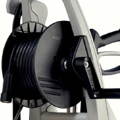 Close-up of a fishing reel on a white background