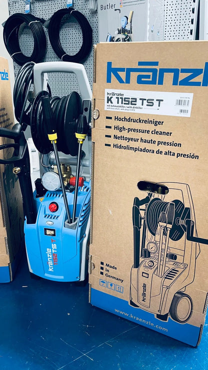 Kranzle high-pressure cleaner with packaging and tools on a blue surface
