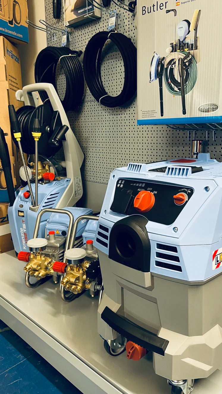 Industrial cleaning equipment on display with a pegboard background