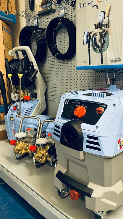 Industrial cleaning equipment on display with a pegboard background