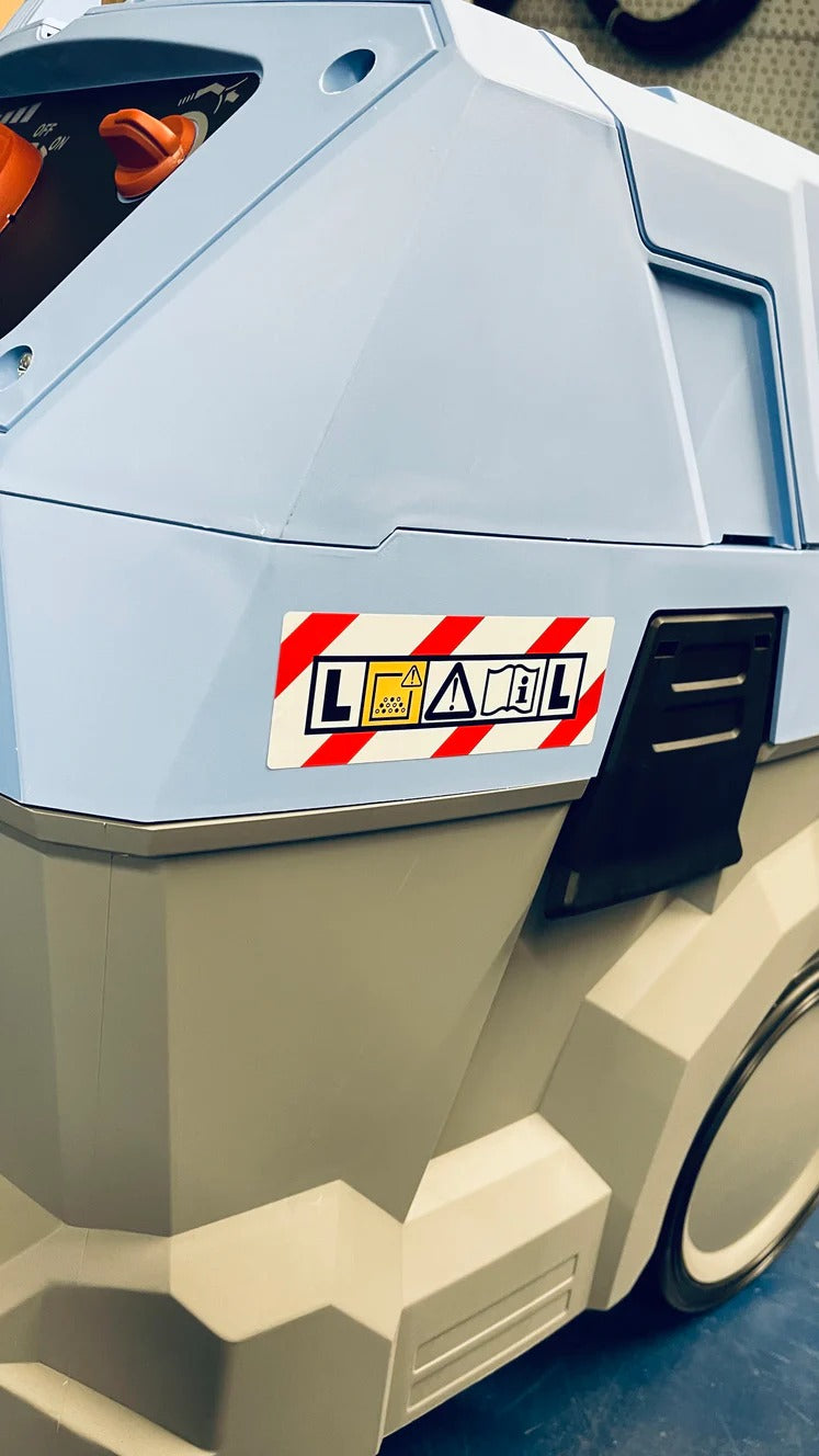 Toy truck with a 'Load' label on a gray background