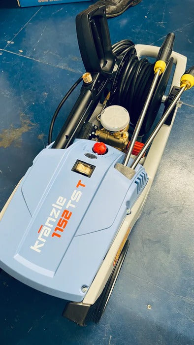 Karcher pressure washer on a blue surface with tools inside